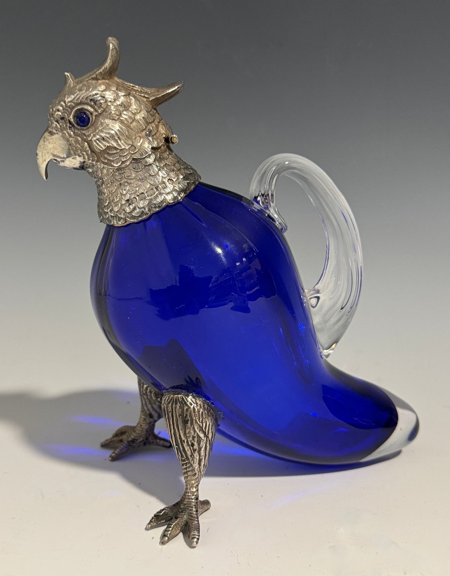 A Bristol Blue Glass and Hallmarked Silver Cockatoo Parrot Claret Jug