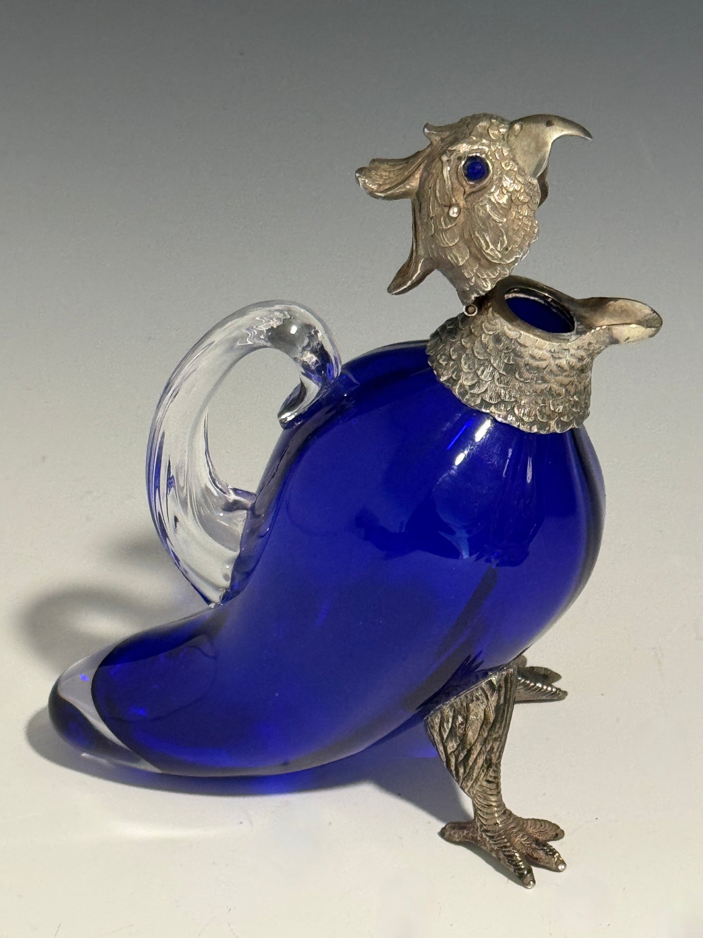 A Bristol Blue Glass and Hallmarked Silver Cockatoo Parrot Claret Jug