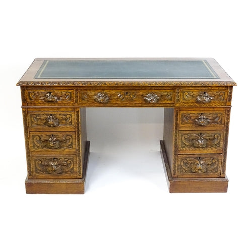 A Late 19thc / Early 20thc Carved Oak Twin Pedestal Desk